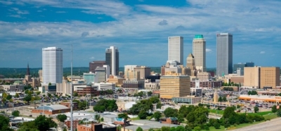 Tulsa city skyline with tall buildings under a clear blue sky